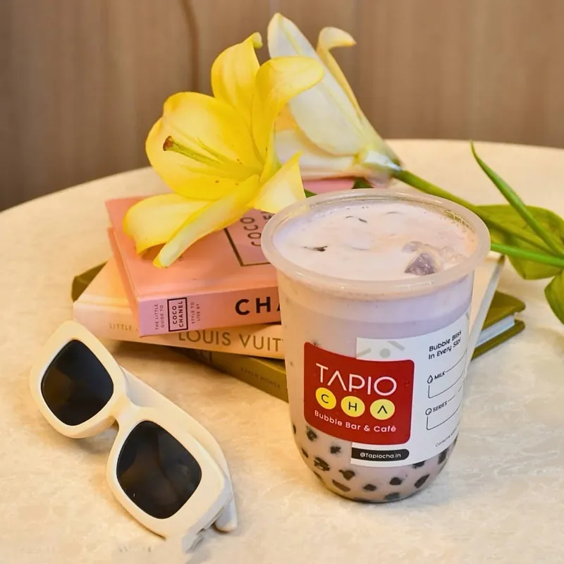 Taro milk tea with lilies and sunglasses